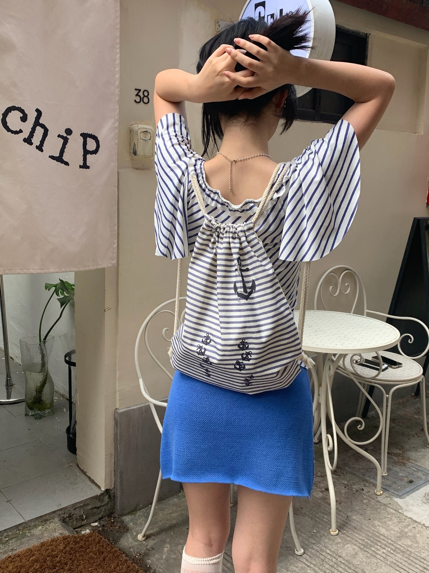 Navy stripe drawstring tote bag in canvas material