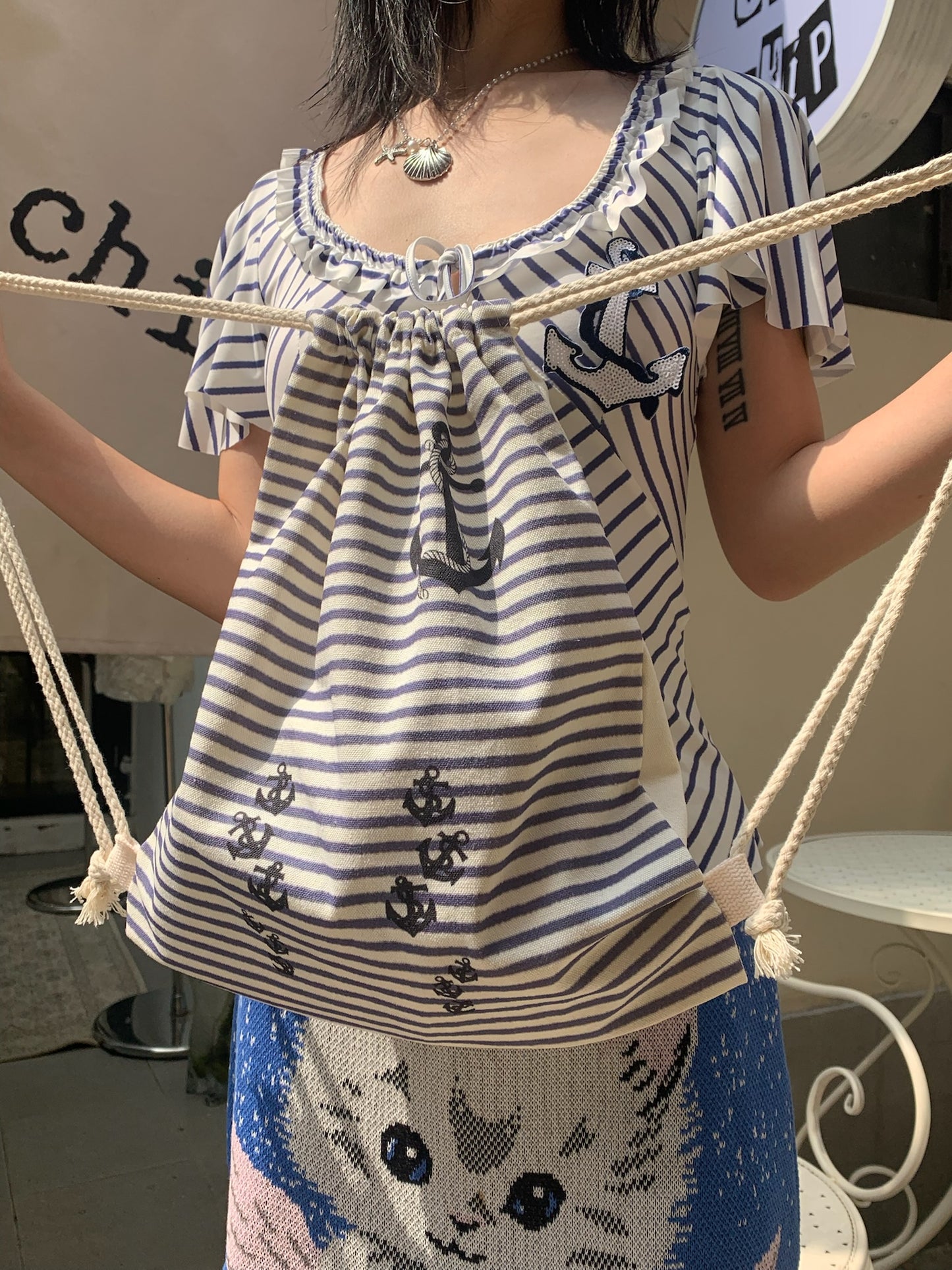 Navy stripe drawstring tote bag in canvas material