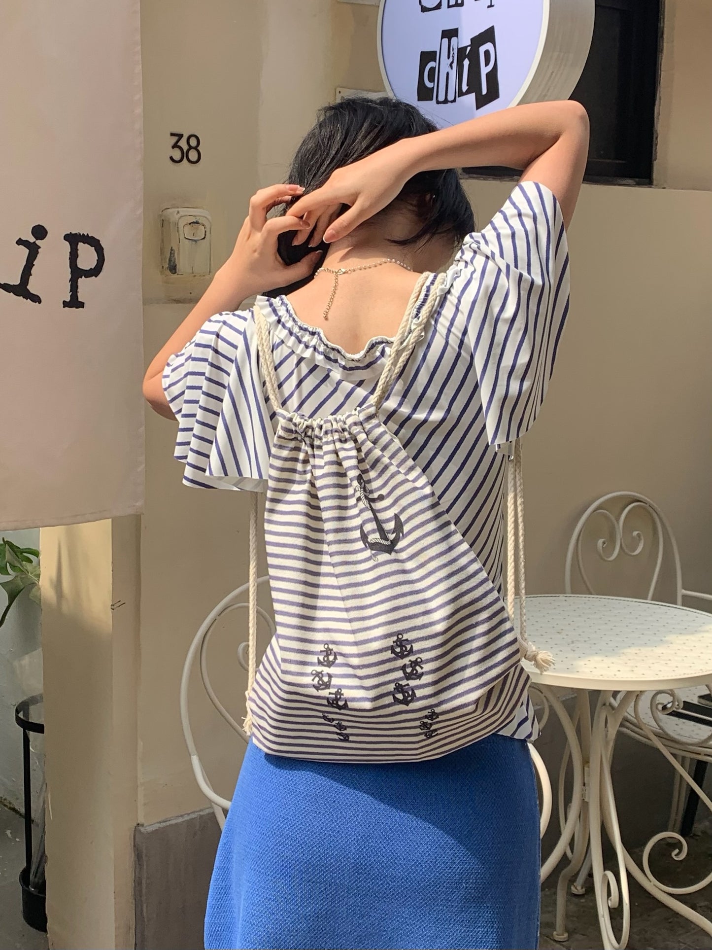 Navy stripe drawstring tote bag in canvas material