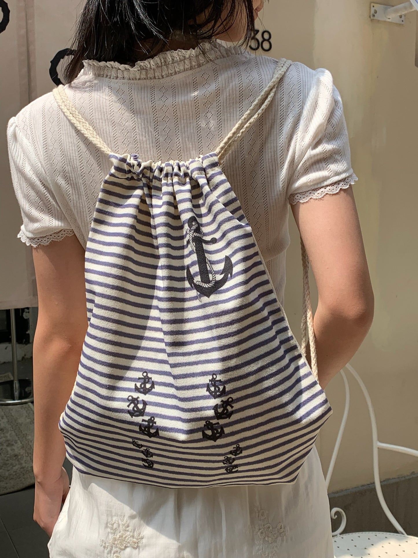 Navy stripe drawstring tote bag in canvas material